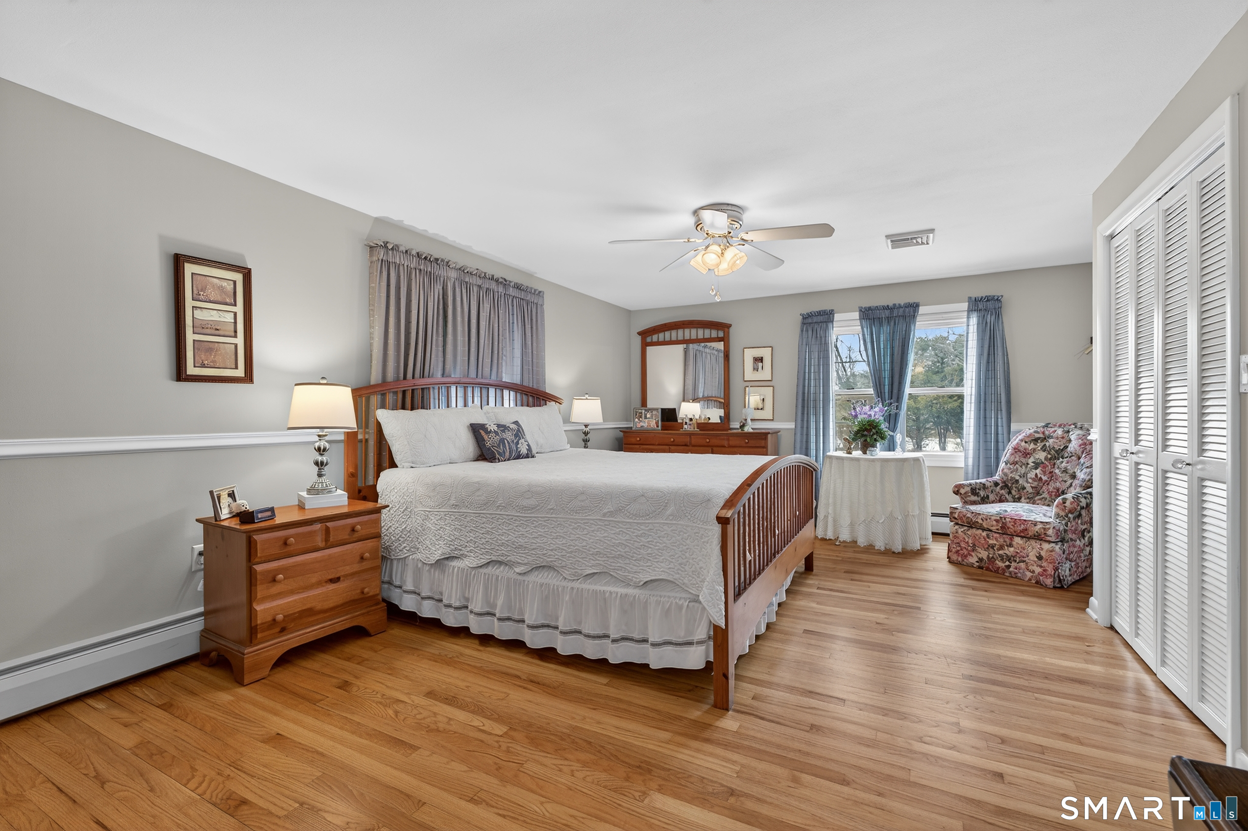 103 Maple Avenue Old Saybrook, CT 06475 - Photo 17 of 34 a bed room with a bed and a couch