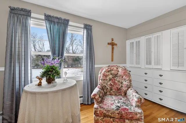 a very nice looking room with a large window and a chandelier