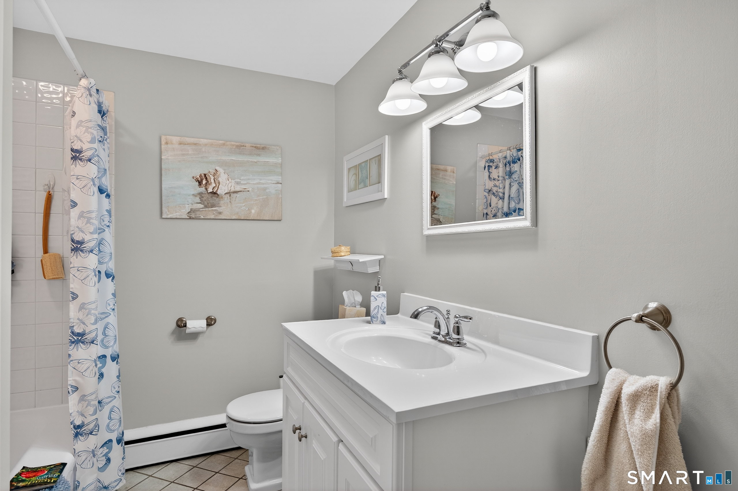 103 Maple Avenue Old Saybrook, CT 06475 - Photo 23 of 34 a bathroom with a sink vanity mirror and toilet