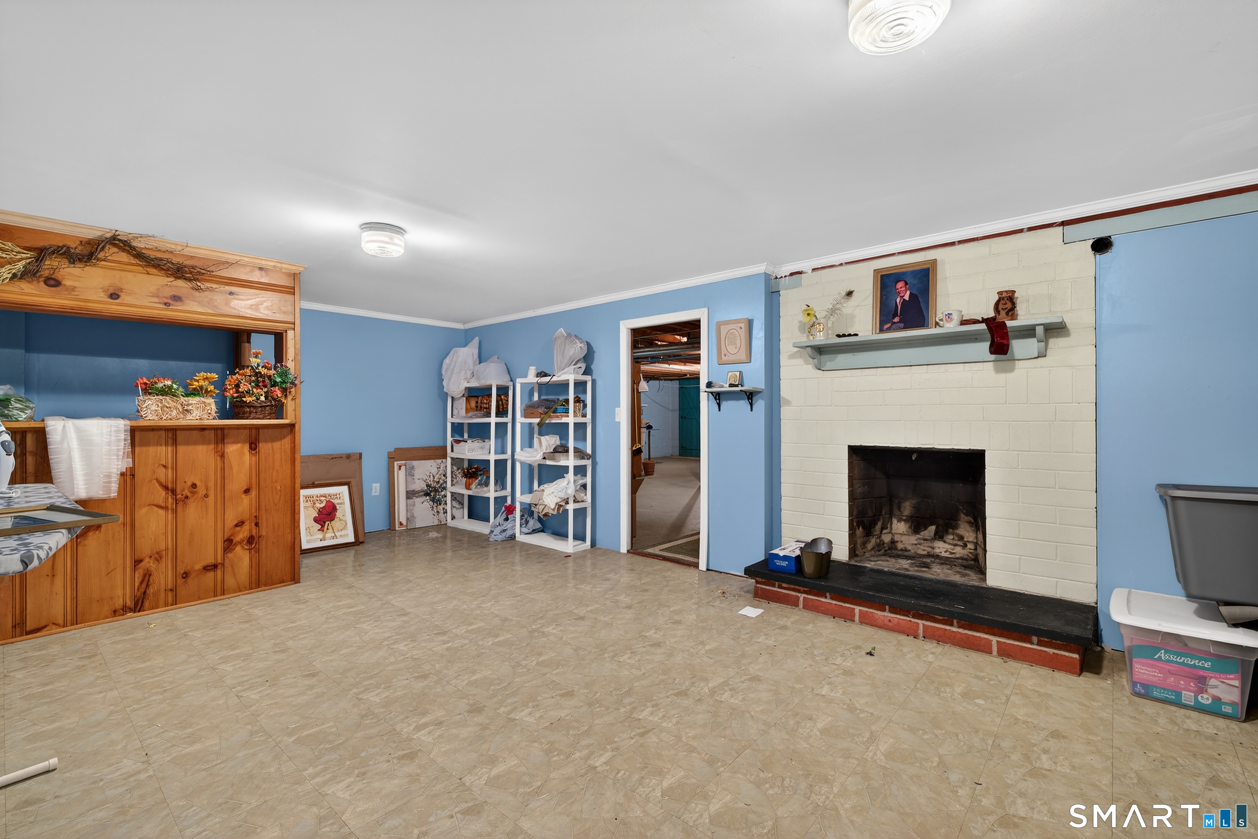 103 Maple Avenue Old Saybrook, CT 06475 - Photo 27 of 34 a living room with furniture and a fireplace