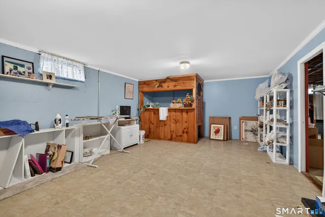 a view of a livingroom with furniture and toys