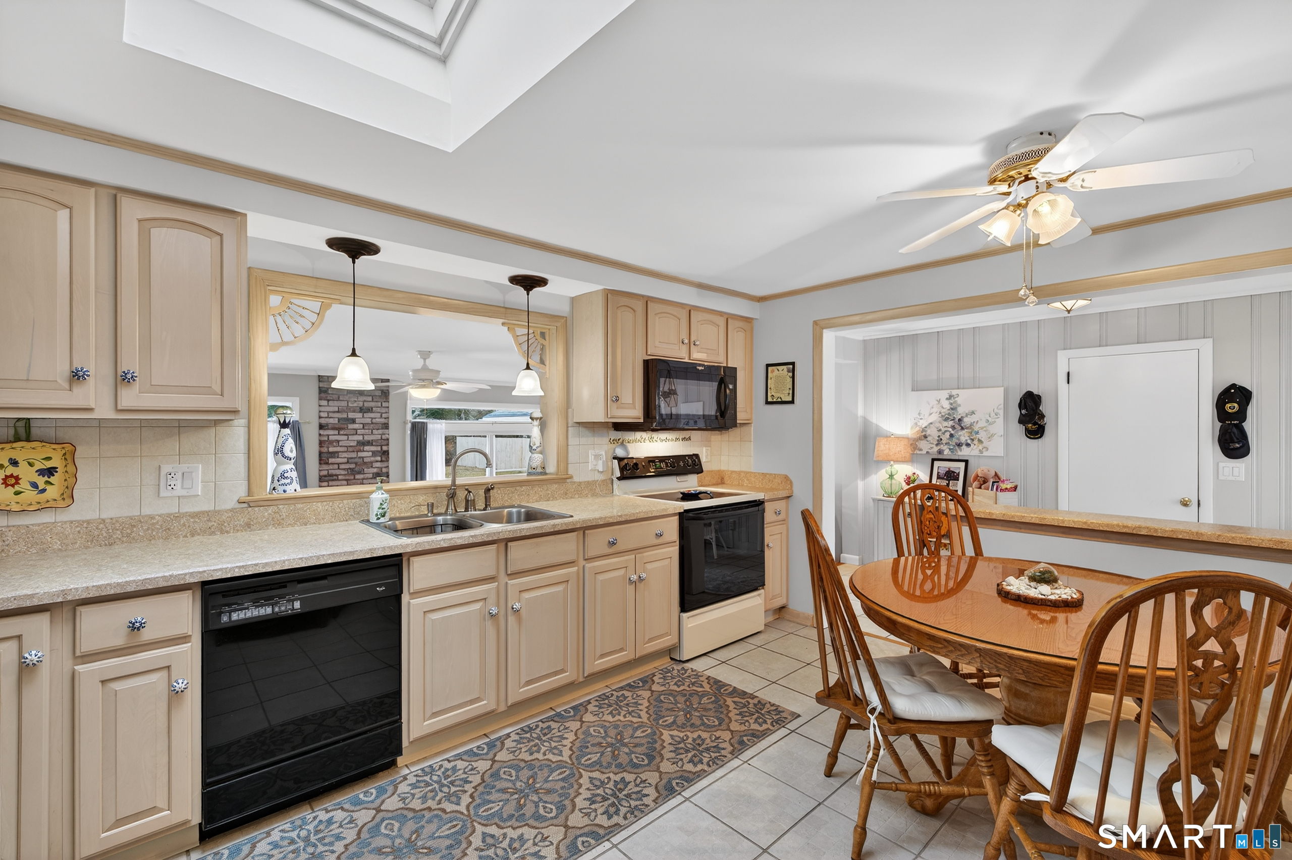 103 Maple Avenue Old Saybrook, CT 06475 - Photo 6 of 34 a kitchen with a sink stove and cabinets