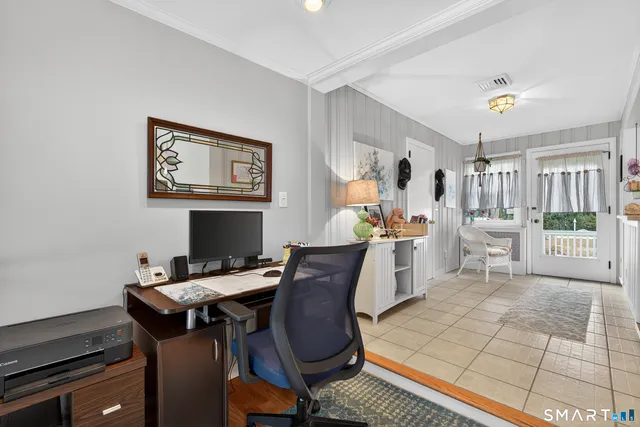 a view of a workspace with furniture