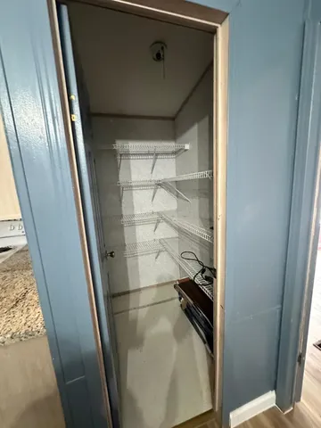 a bathroom with a glass door shower and toilet