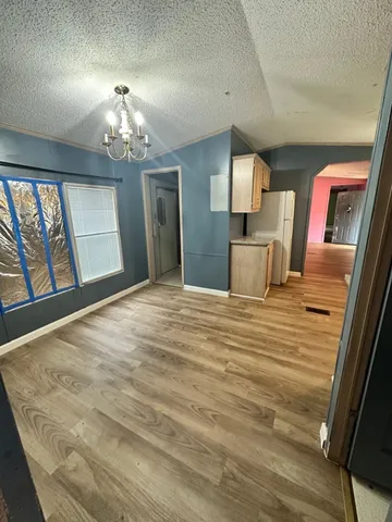 wooden floor with chandelier and wooden floor