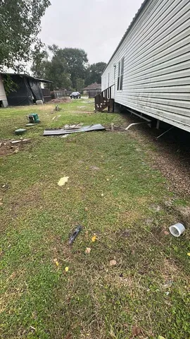 a view of a back yard of the house