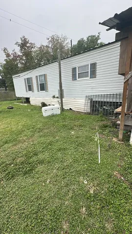 a house view with a backyard space