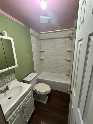 a bathroom with a sink mirror toilet and bathtub