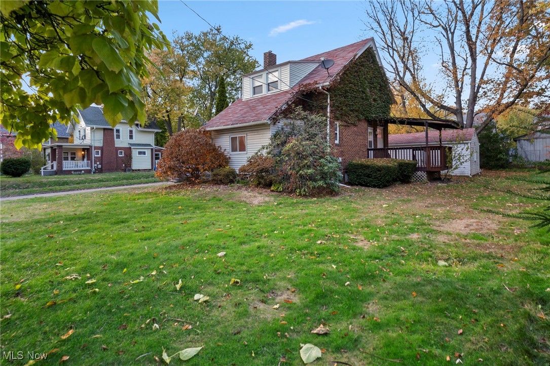 1589 Hampton Road Akron, OH 44305 - Photo 13 of 26 View of home's exterior with a chimney and a yard