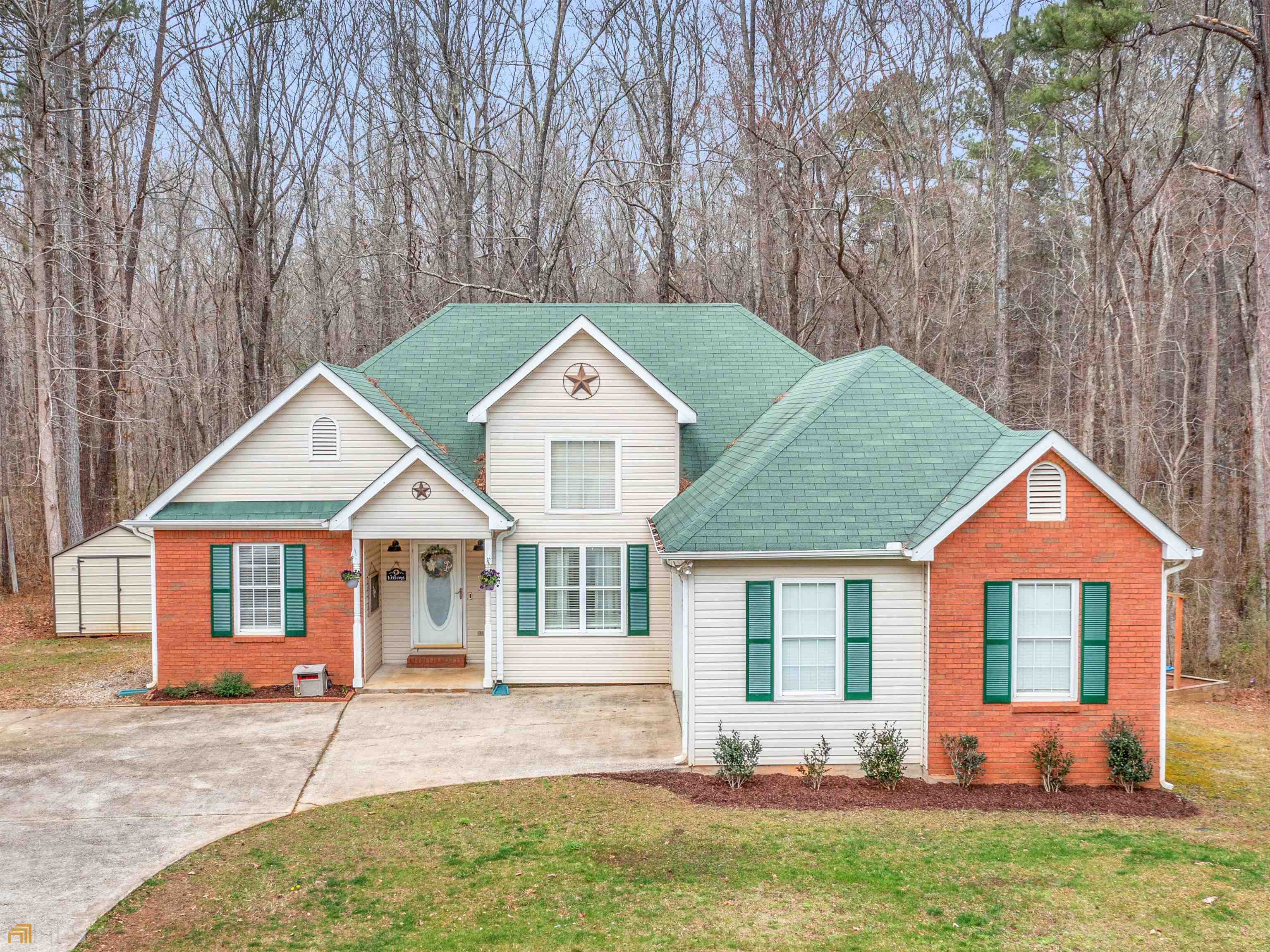 a front view of a house with yard