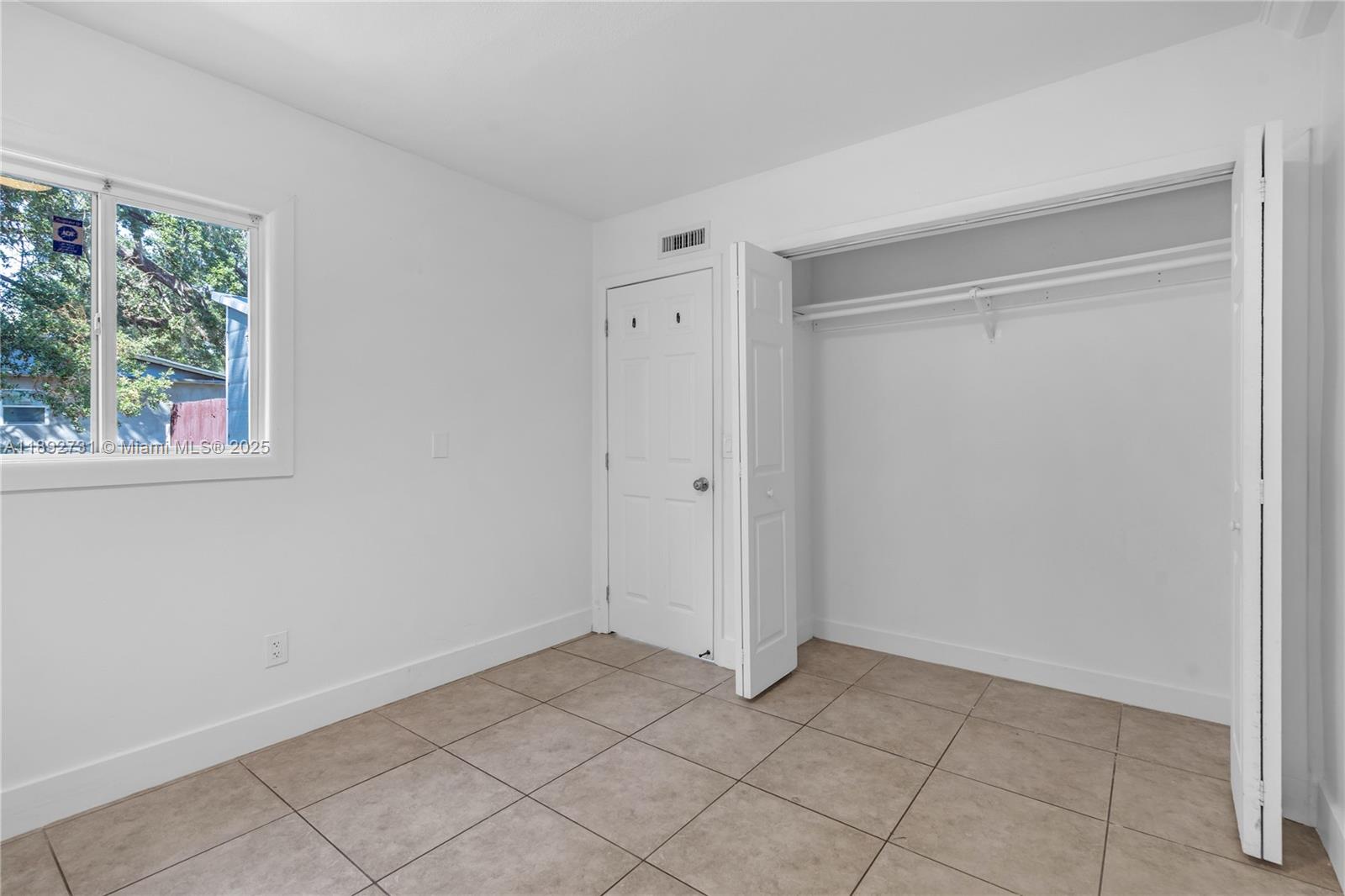 4111 Southwest 33rd Street, Unit B West Park, FL 33023 - Photo 5 of 8 a view of an empty room with a window