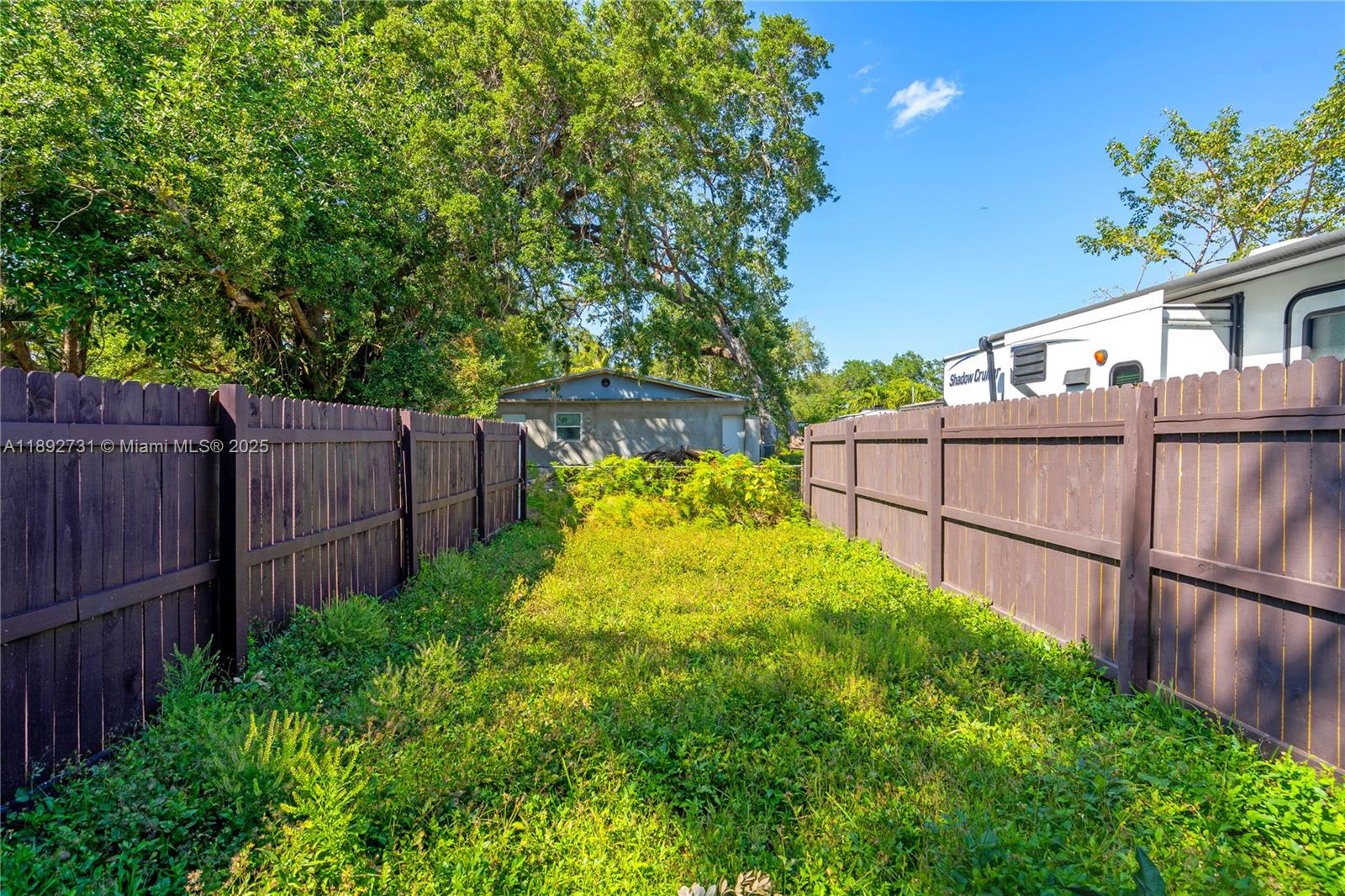 4111 Southwest 33rd Street, Unit B West Park, FL 33023 - Photo 7 of 8 a view of a backyard with wooden fence
