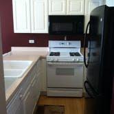 16652 South Windsor Lane Lockport, IL 60441 - Photo 11 of 15 a kitchen with a stove and a microwave
