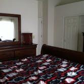 16652 South Windsor Lane Lockport, IL 60441 - Photo 14 of 15 a room with a bed and a dresser