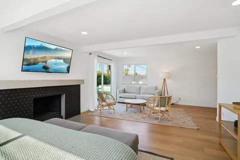 a bedroom with furniture and a fireplace
