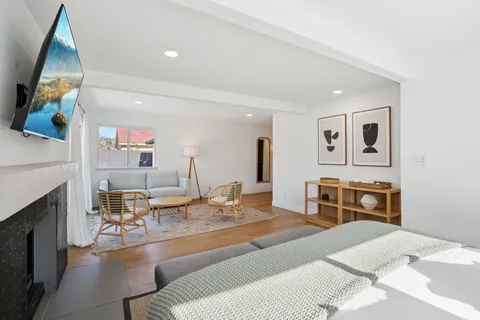 a living room with furniture and a chair