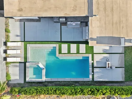 a aerial view of a house with a yard