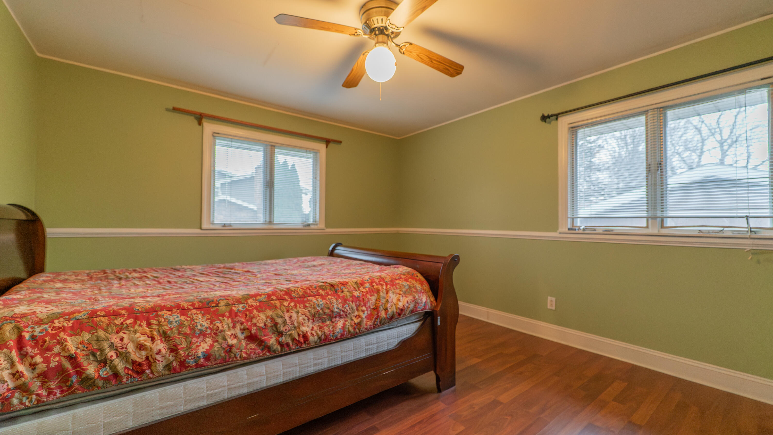 9439 Walnut Drive Munster, IN 46321 - Photo 25 of 40 a bed sitting in a bedroom next to a window