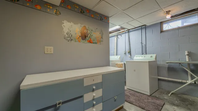 a utility room with dryer and washer