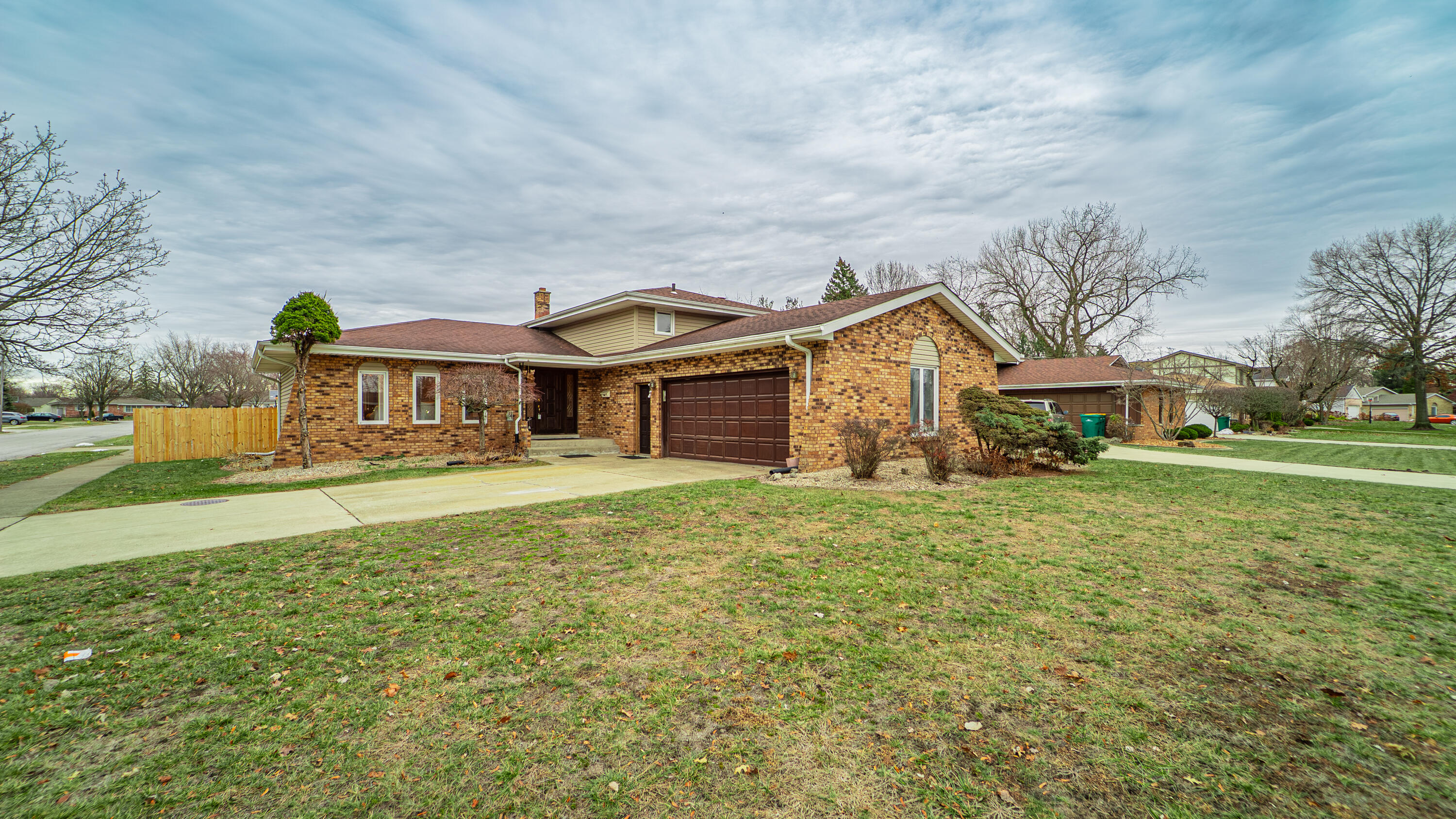 9439 Walnut Drive Munster, IN 46321 - Photo 38 of 40 a front view of a house with a garden