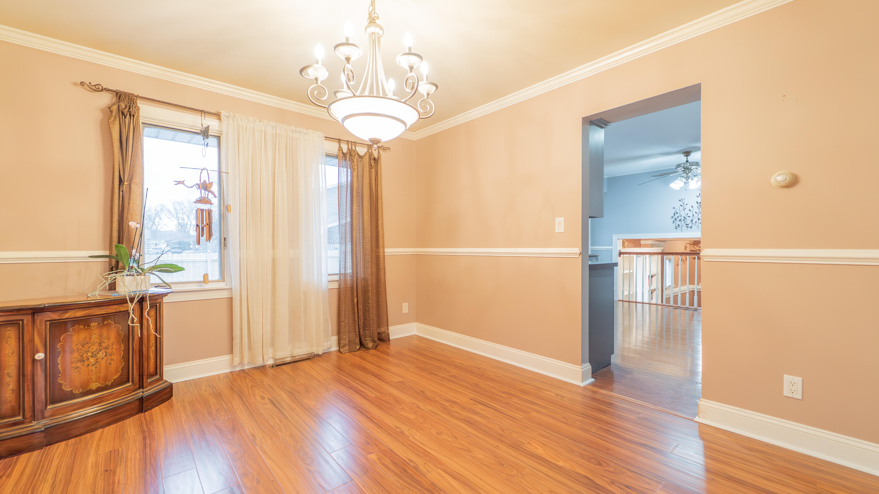 9439 Walnut Drive Munster, IN 46321 - Photo 8 of 40 a view of empty room with wooden floor and fan