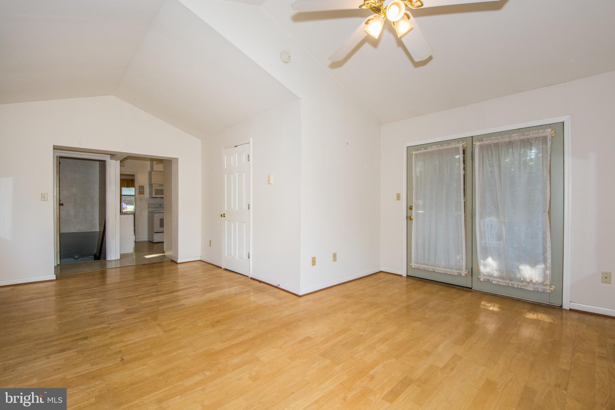 803 Quincy Road Baltimore, MD 21286 - Photo 14 of 28 a view of an empty room with a chandelier fan