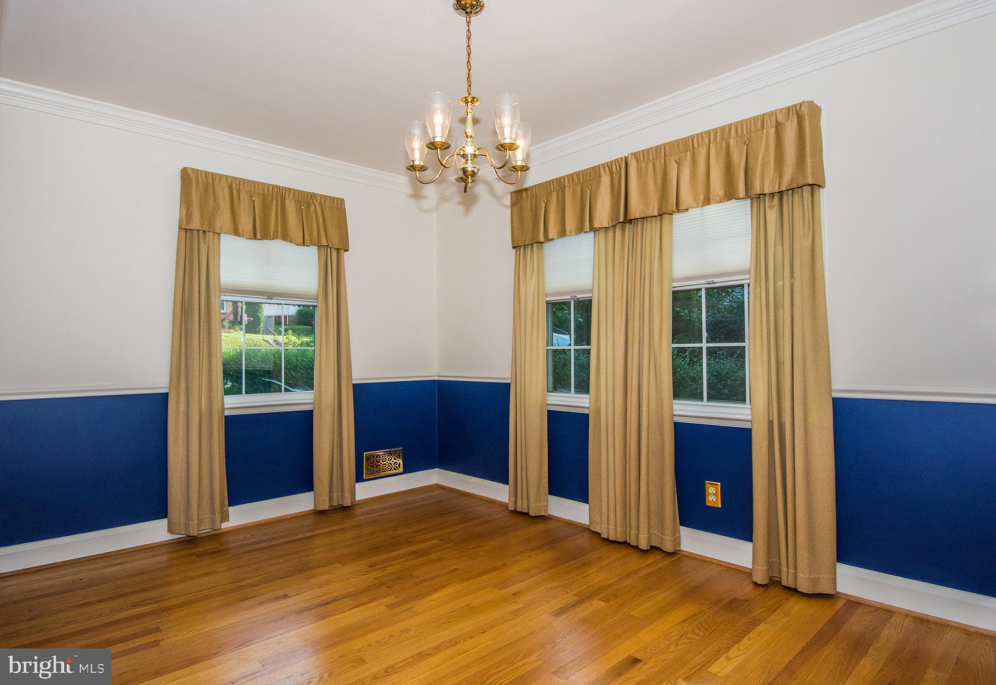 803 Quincy Road Baltimore, MD 21286 - Photo 8 of 28 a view of livingroom with chandelier and wooden floor