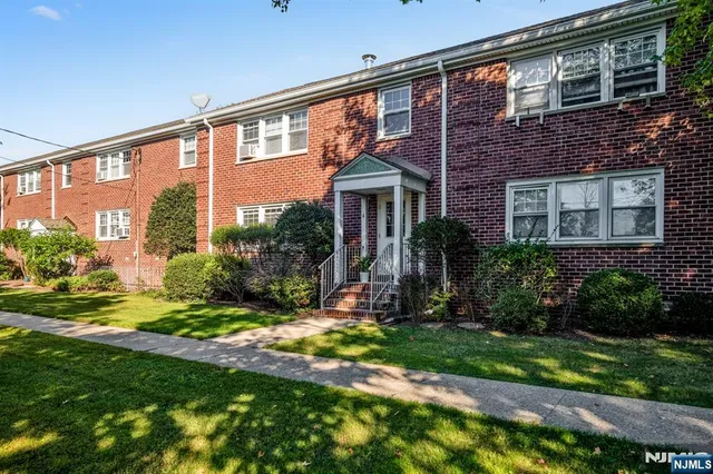 a view of a house with a yard and plants