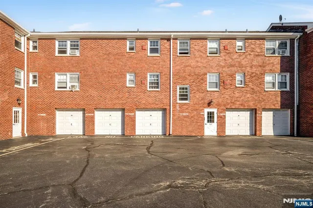 a front view of a building with many windows