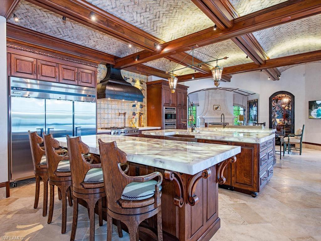 840 Admiralty Parade Naples, FL 34102 - Photo 16 of 50 a dining table with chairs and window