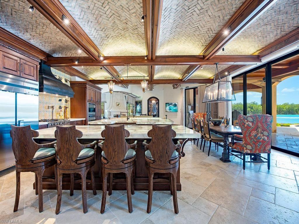 840 Admiralty Parade Naples, FL 34102 - Photo 18 of 50 a view of a dining area with furniture window and outside view