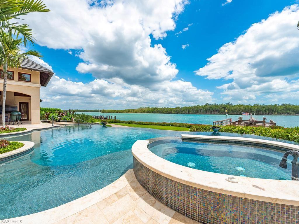 840 Admiralty Parade Naples, FL 34102 - Photo 2 of 50 a view of swimming pool with a yard