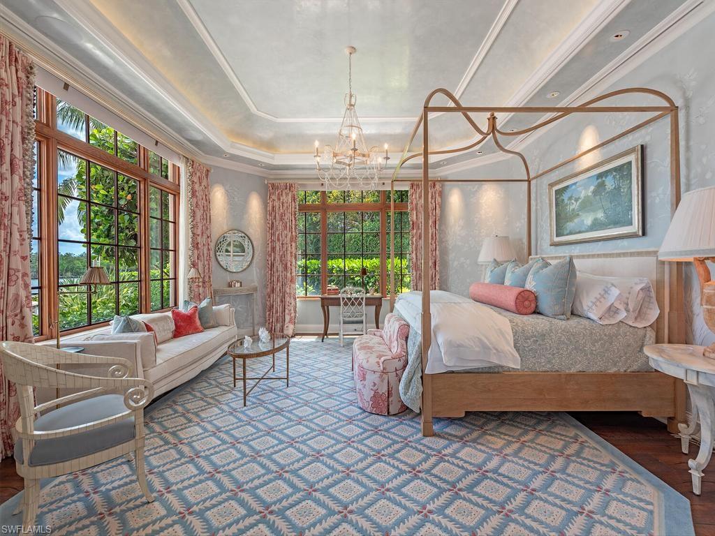 840 Admiralty Parade Naples, FL 34102 - Photo 27 of 50 a bed room with a bed and a couch