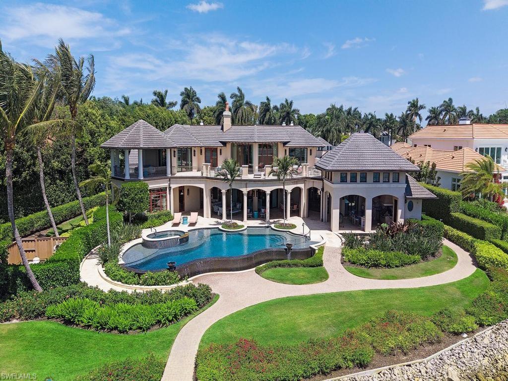 840 Admiralty Parade Naples, FL 34102 - Photo 32 of 50 an aerial view of a house with swimming pool garden and patio