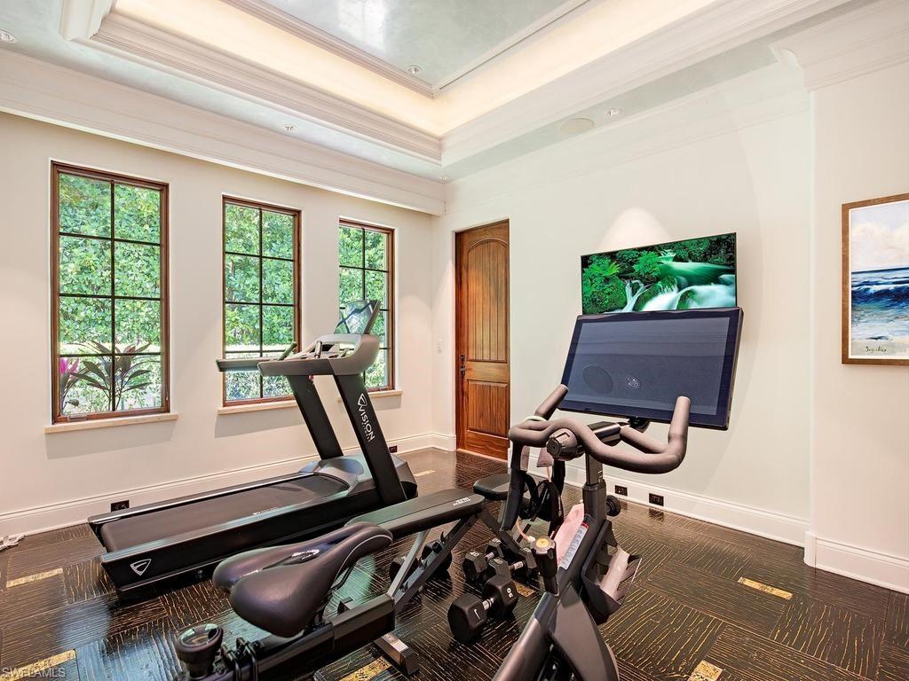 840 Admiralty Parade Naples, FL 34102 - Photo 42 of 50 a room with gym equipment and a window