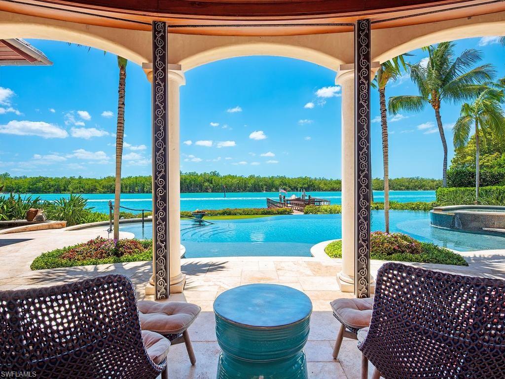 840 Admiralty Parade Naples, FL 34102 - Photo 5 of 50 a view of a patio with a table chairs and a patio