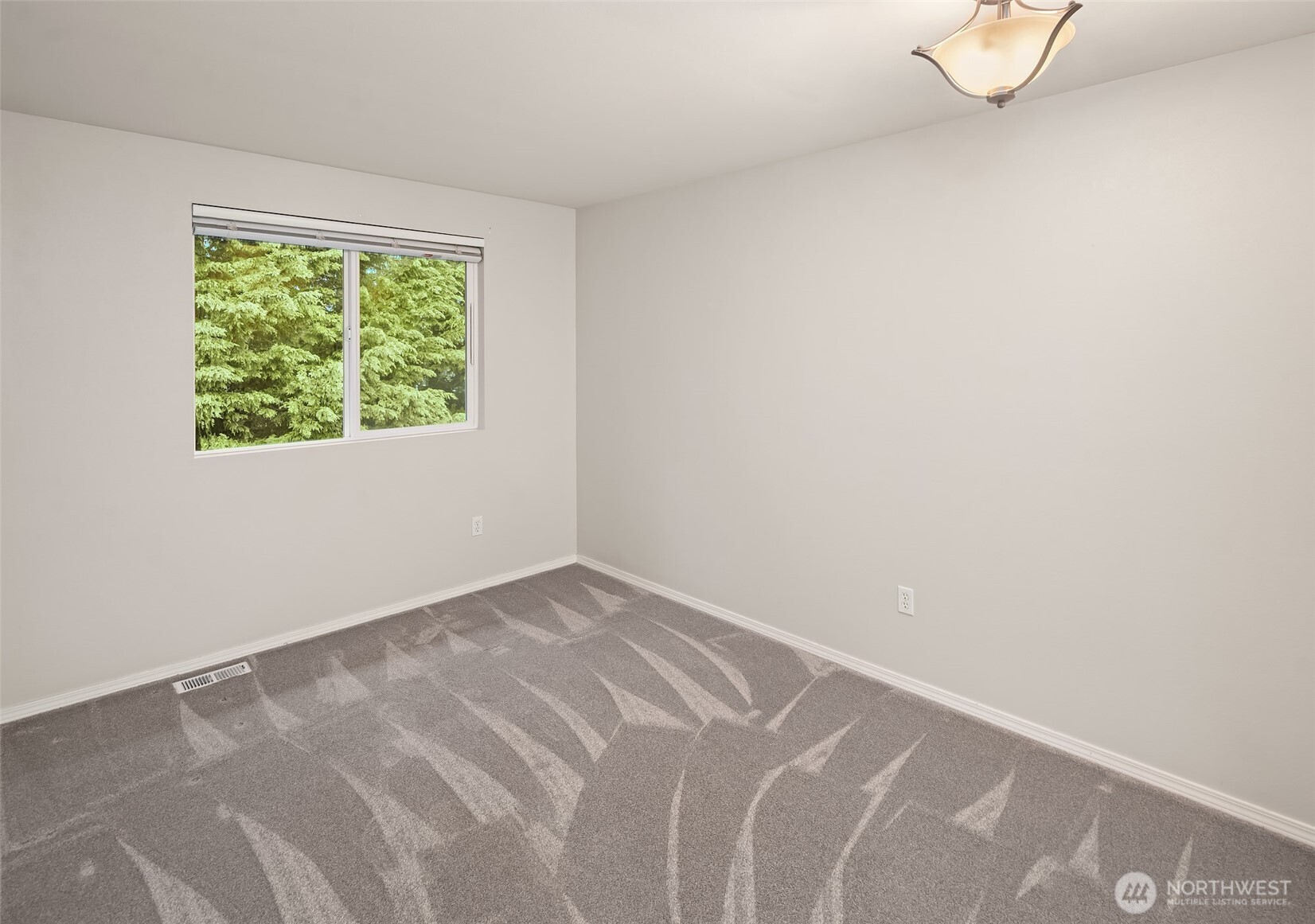 2009 62nd Loop Southeast Auburn, WA 98092 - Photo 11 of 24 an empty room with a window
