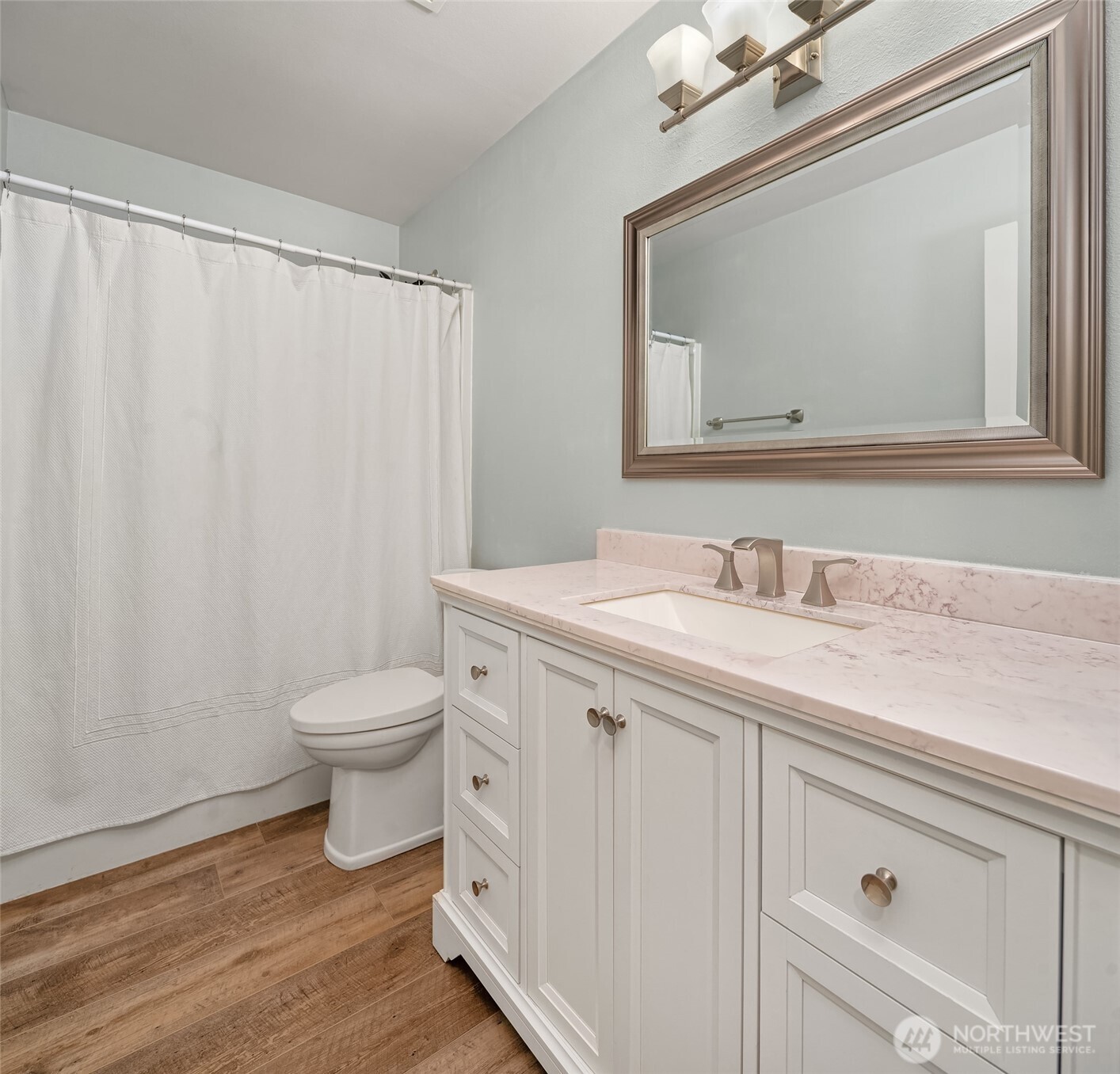 2009 62nd Loop Southeast Auburn, WA 98092 - Photo 14 of 24 a bathroom with a granite countertop sink a toilet and a mirror