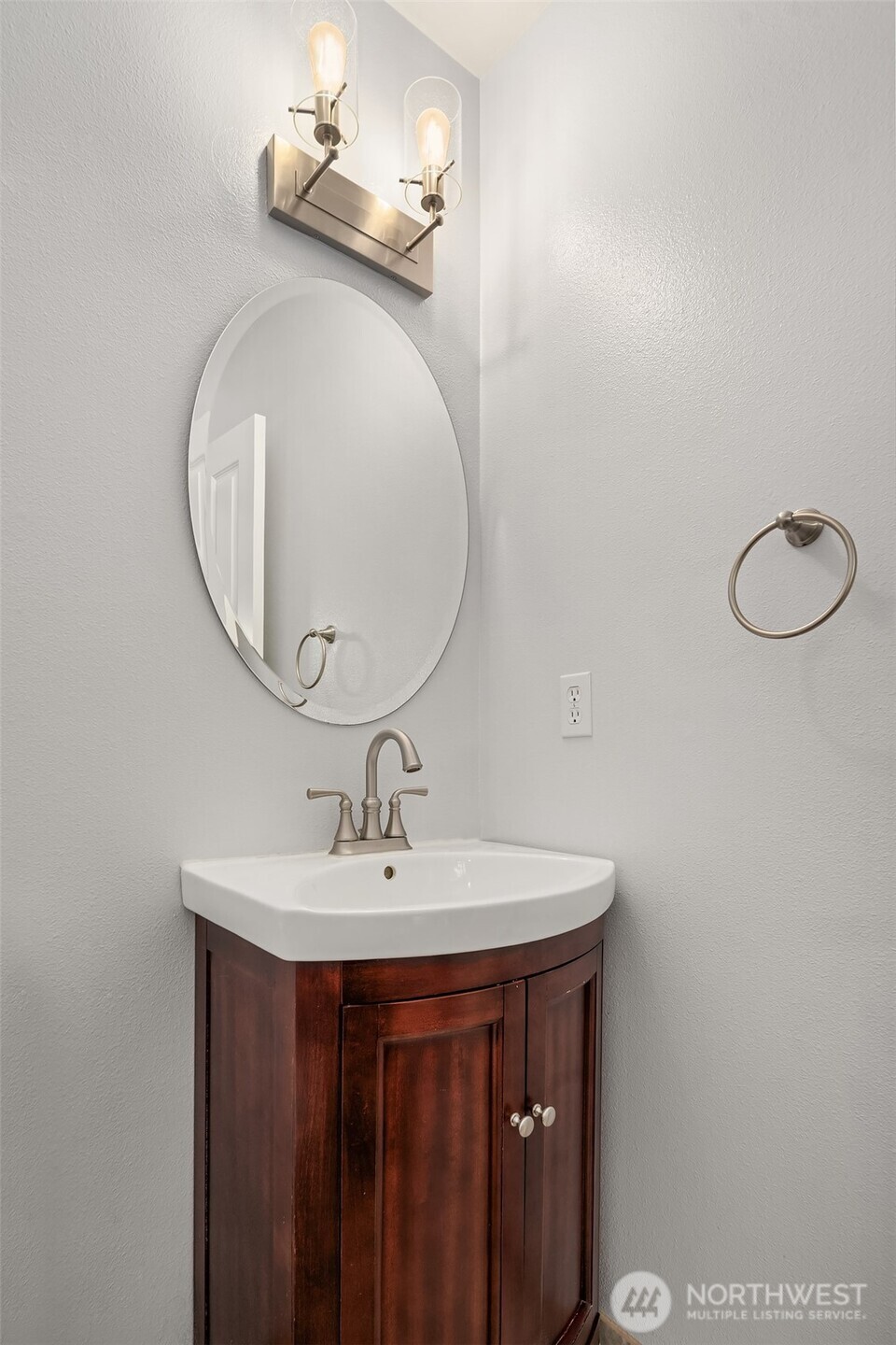 2009 62nd Loop Southeast Auburn, WA 98092 - Photo 16 of 24 a bathroom with a sink and a mirror