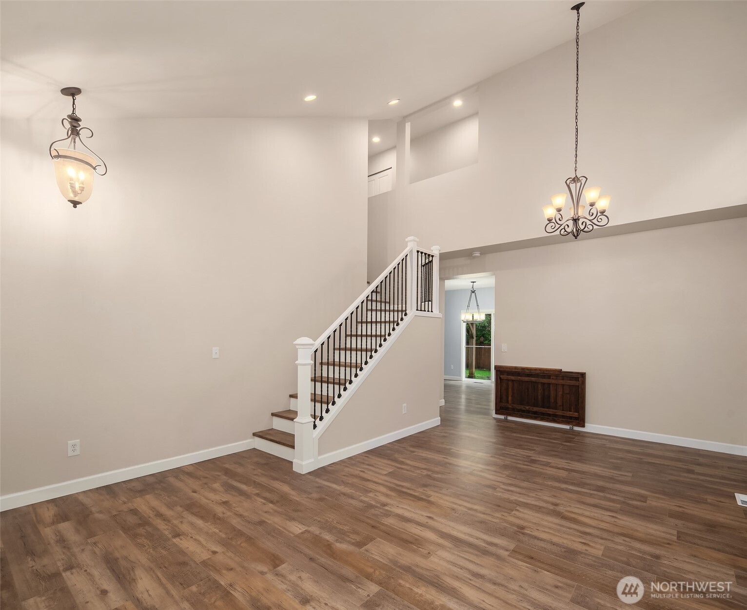 2009 62nd Loop Southeast Auburn, WA 98092 - Photo 4 of 24 a view of a livingroom with wooden floor and stairs