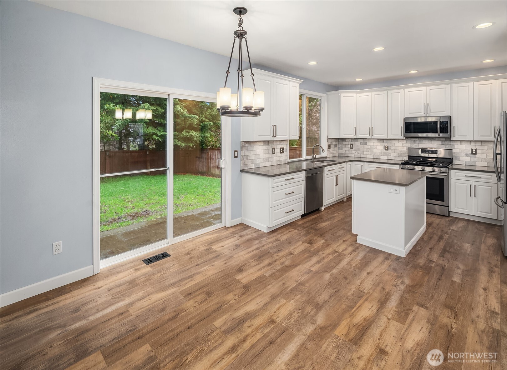 2009 62nd Loop Southeast Auburn, WA 98092 - Photo 7 of 24 a kitchen with a refrigerator and a sink
