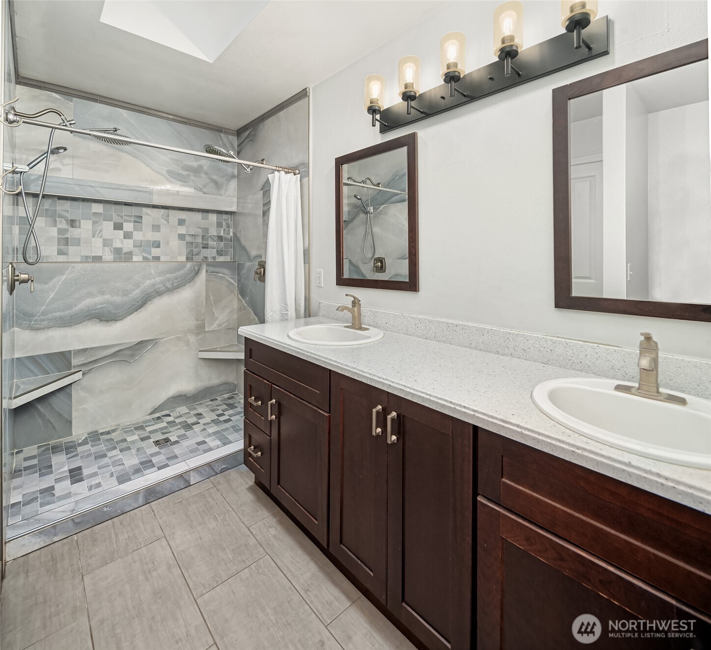 2009 62nd Loop Southeast Auburn, WA 98092 - Photo 10 of 24 a bathroom with a double vanity sink mirror and shower