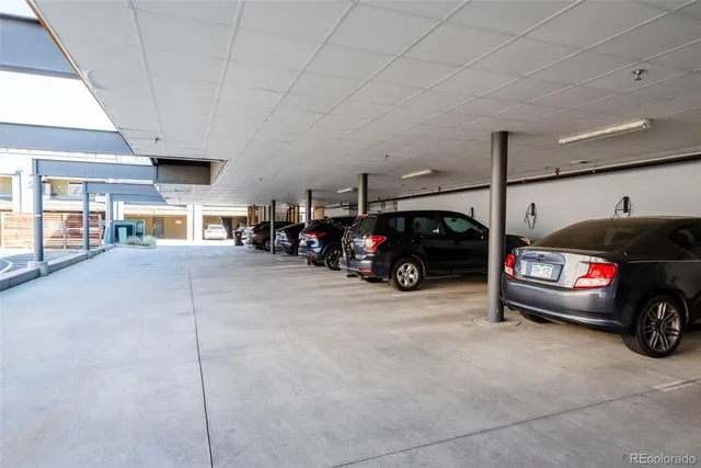 a view of a patio with a table and chairs under an umbrella