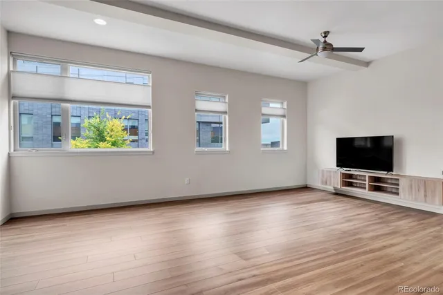 a view of a livingroom with kitchen and furniture