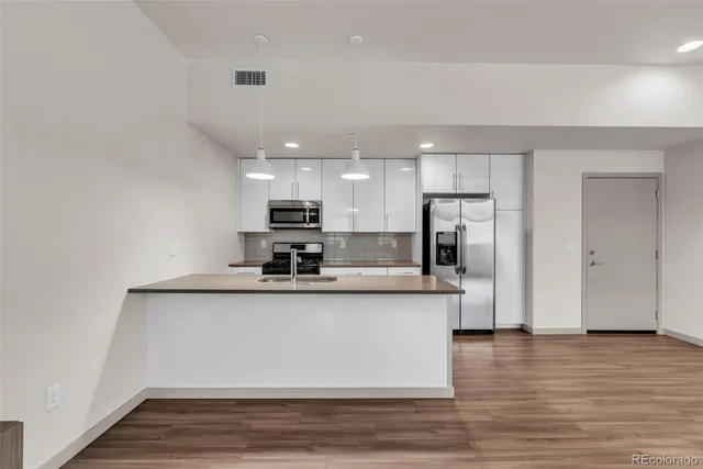 a kitchen with a stove and a microwave