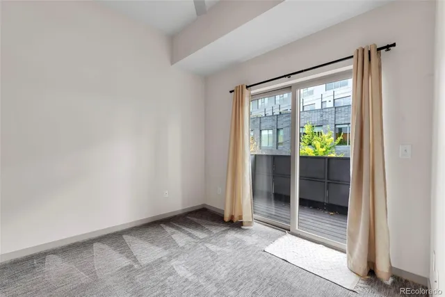 a bathroom with a sink a toilet a mirror and shower