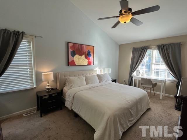 8644 Swarthmore Drive Raleigh, NC 27615 - Photo 19 of 26 a bedroom with a bed and a window