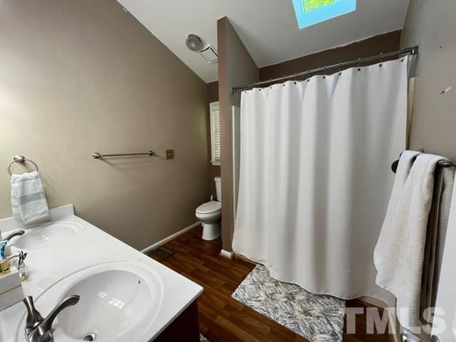 8644 Swarthmore Drive Raleigh, NC 27615 - Photo 20 of 26 a bathroom with a sink and a mirror