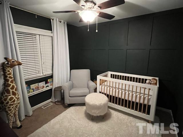 8644 Swarthmore Drive Raleigh, NC 27615 - Photo 22 of 26 a bedroom with furniture and a window