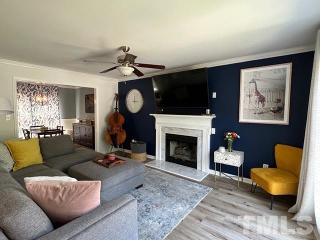 8644 Swarthmore Drive Raleigh, NC 27615 - Photo 3 of 26 a living room with furniture and a fireplace